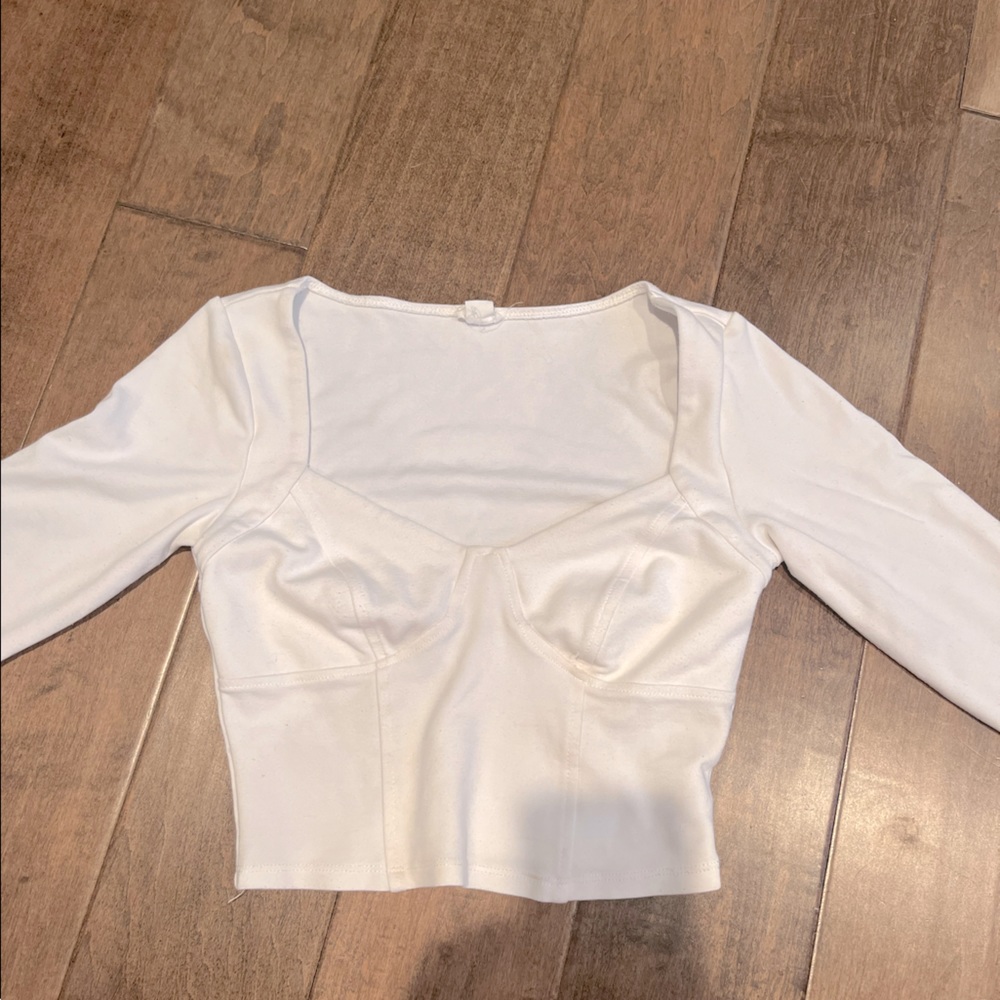 White long sleeve low cut shirt with under stitch at chest